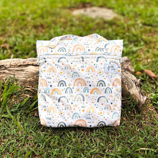 Reusable shopping bag with rainbow pattern on grass